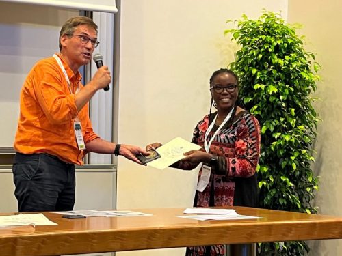 Beatrice Ekesa accepting the ISHS convener award on behalf of Walter Ocimati